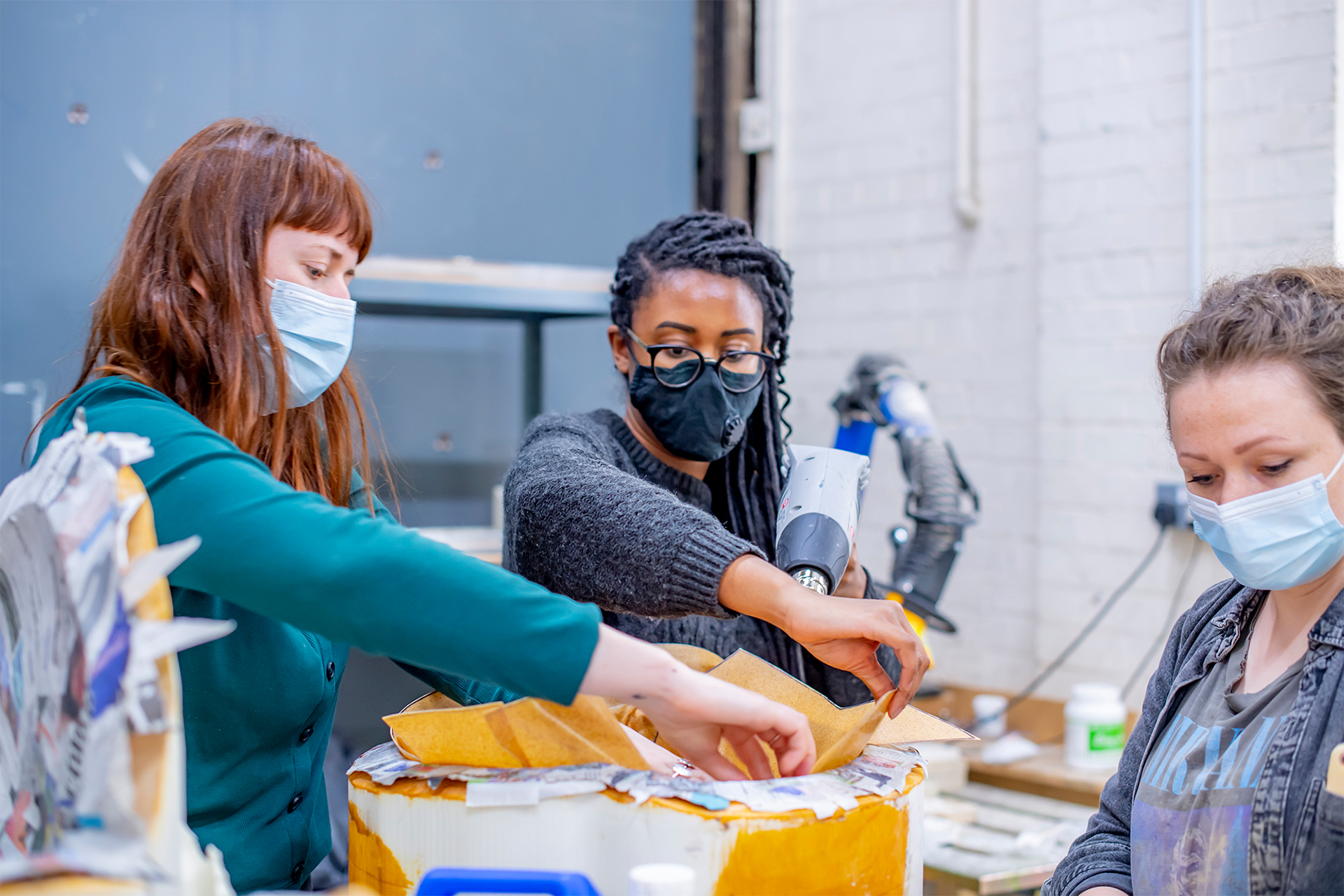 Students working in studio on models