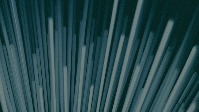 Beams of light on dark blue background